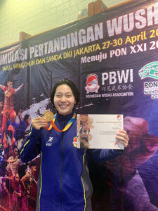 Bella Aprillia Kowal Marinir Cantik Raih Mendali Emas Kejuaraan Wushu Sanda